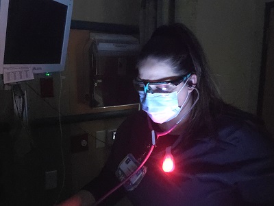 Photo of the uNight Light being used in a dark hospital room