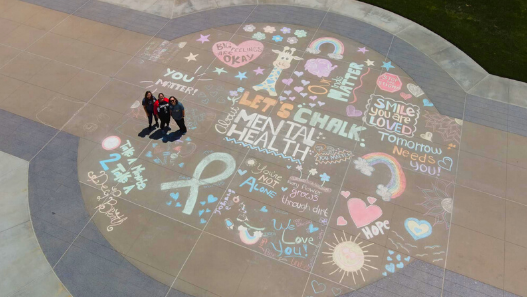 Bird's eye view of the Let's Chalk About Mental Health artwork on Valley Children's South Lawn prome