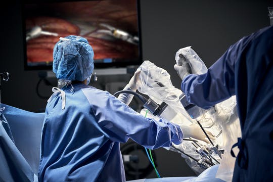 The Da Vinci surgical system being used in surgery