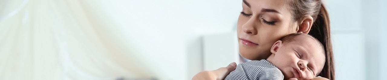 A mother holds her baby