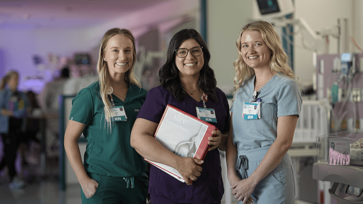 Three NICU nurses smiling