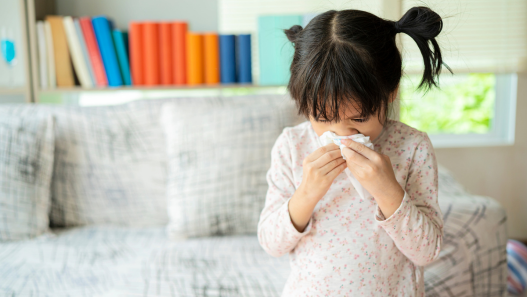 Child blowing nose