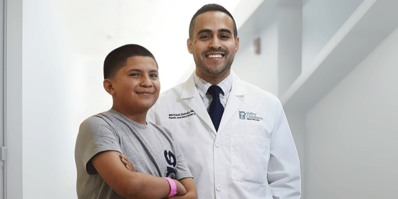 Arturo and Dr. Galvez smile together