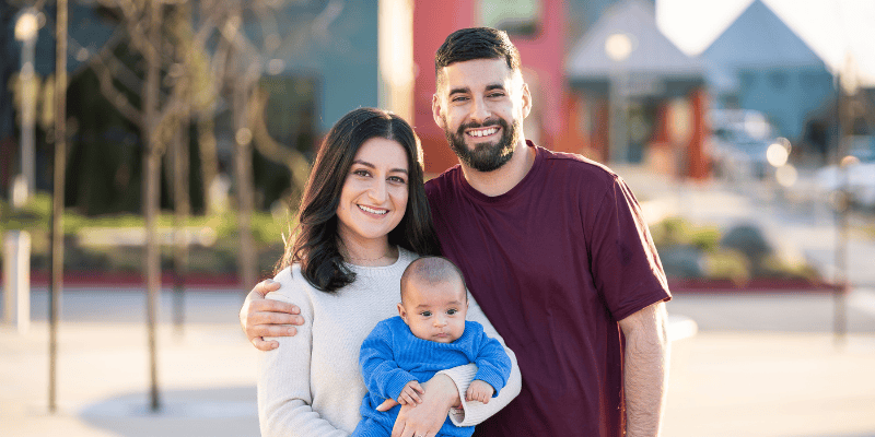 Jasmine and her family smile