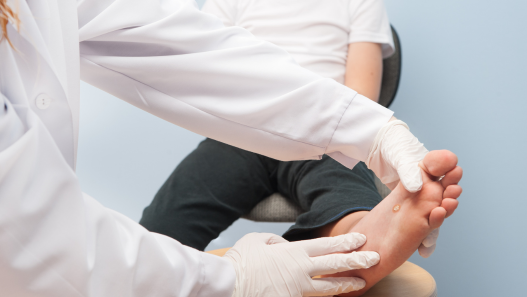 Child'd foot being inspected by a doctor