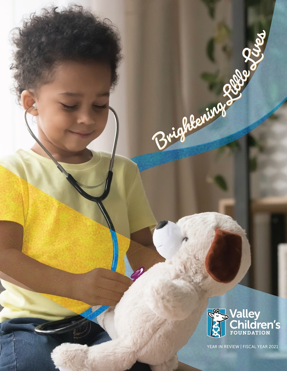 A little boy wearing a stethoscope plays with a stuffed toy 