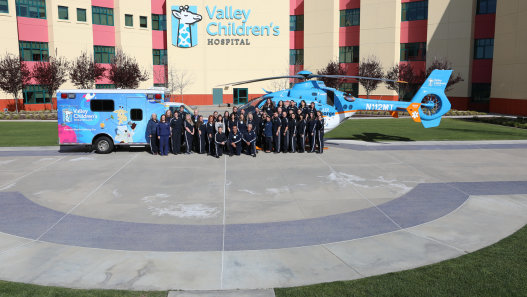 Valley Children's transport team posing in front of ambulance and Air George