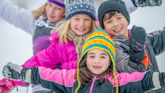 Children posing for photo in the snow