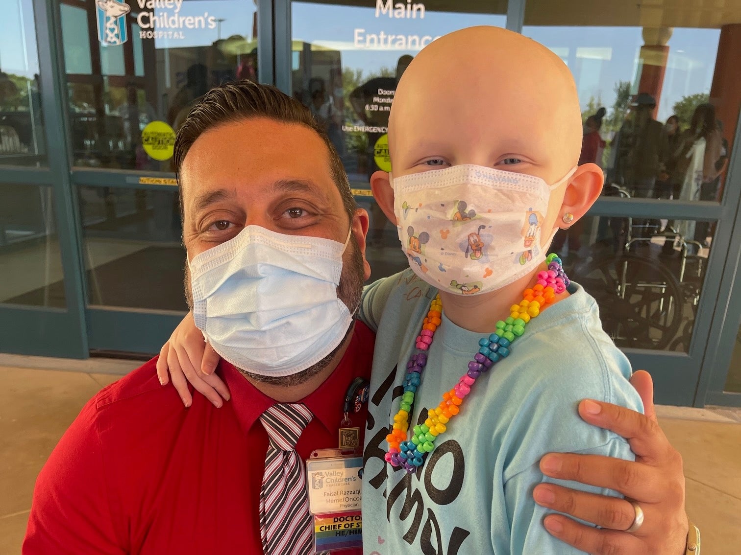 Tesla and a doctor are wearing face masks