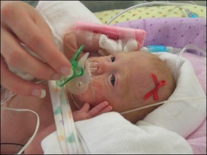 Christina gives Kara a pacifier