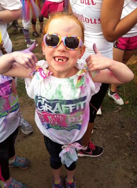 A young Kara gives a thumbs up