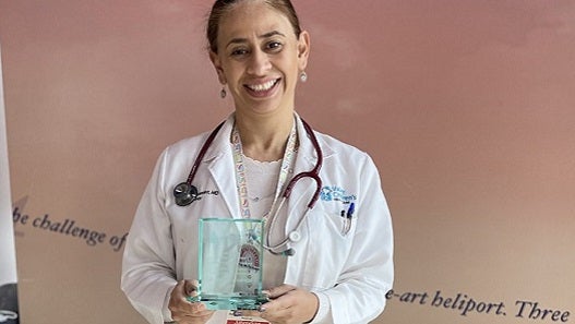 Photo of Valley Children's pediatric oncologist/hematologist Dr. Karen Fernandez holding the Physici