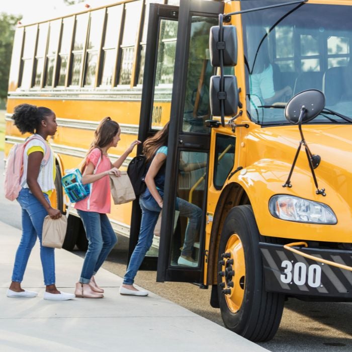 Children boarding a school bus
