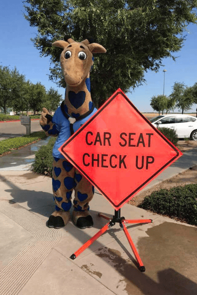 George the Giraffe attends a car seat checkup event