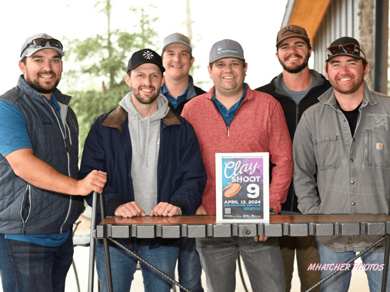 Members of Padrinos Guild smile at their annual Clay Shoot event