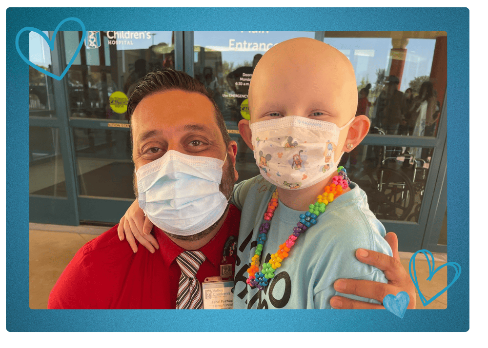 Tesla smiles with Dr. Faisal Razzaqi